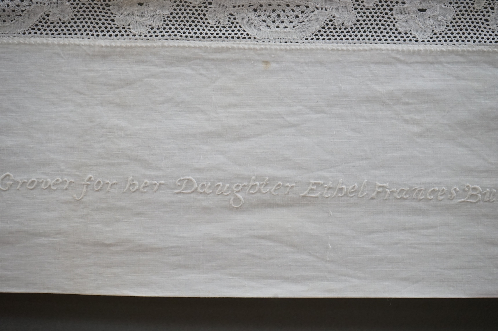 An unusual Victorian white linen hand worked table cloth. Embroidered along one edge, Wrought by L. Grover for her daughter Ethel Frances Burbury 1895. Together with three crochet edged cloths and a circular embroidered